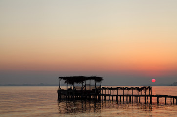 Fototapeta premium Extended wooden platform during sunrise