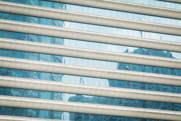 Obraz premium Buildings reflected in windows of modern office building