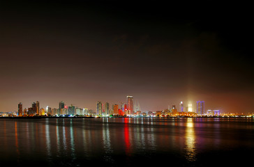 Fototapeta na wymiar Illuminated Al Fateh Highway Highrise buildings