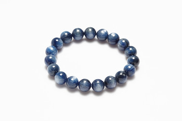Lucky stone bracelet on white background.