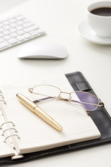Office items and coffee on desk
