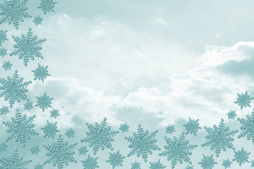 Teal Snowflakes with Clouds Background