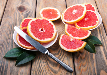 Naklejka na ściany i meble Grapefruits with knife