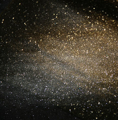 glitter vintage lights background. light silver, gold, black. defocused.
