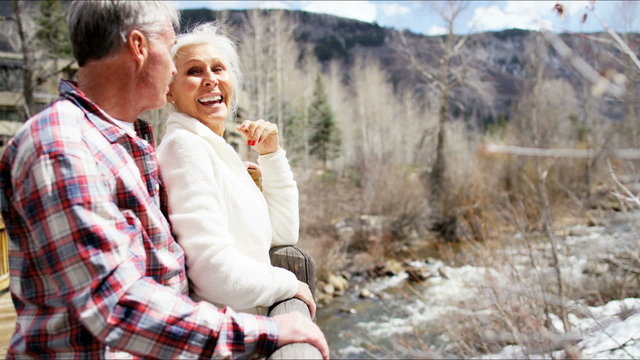 Caucasian retirement male female older couple active tourism winter travel
