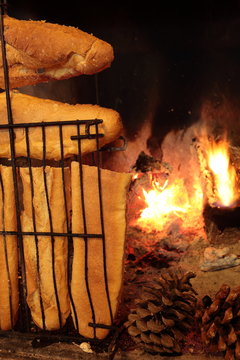 bread baking in the heat of a fire

