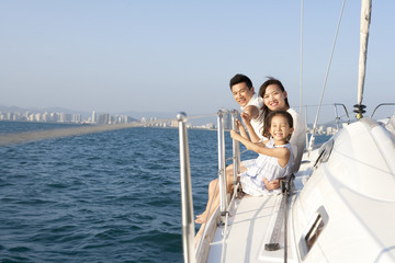 Happy family sitting on the deck