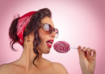  woman with Lollipop on pink background