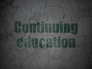 Learning concept: Continuing Education on grunge wall background
