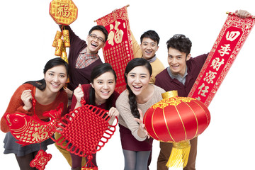 Cheerful young friends with decorations in Chinese New Year