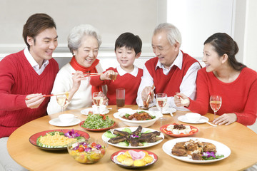 Three generations enjoying a Chinese New Year dinner together