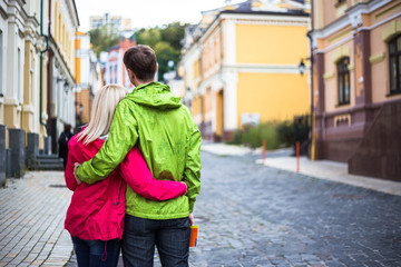 Happy couple in colorful jackets on vacation holidays 