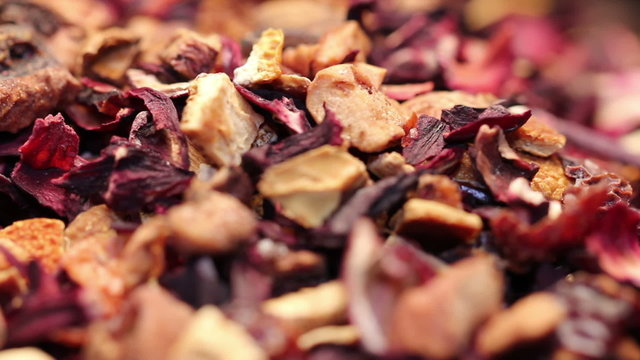 Pile of fruit tea with petals and dry fruit, rotating