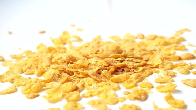 Corn flakes cereals dropping at table