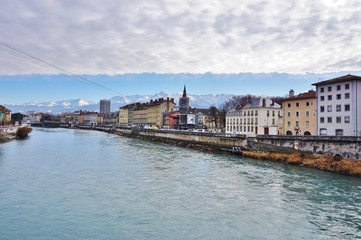 Obraz premium The town of Grenoble, the capital of the French department of Isere at the foot of the Alps mountains