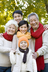 Multi Generation Familiy Enjoying a Park in Autumn