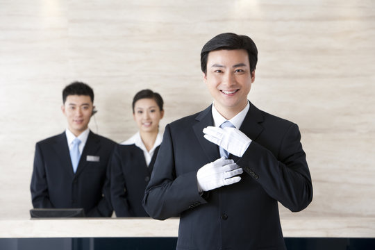 Young Employees Standing In Hotel Reception