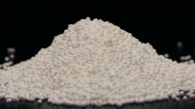 Pile of tapioca pearls isolated on black, rotating