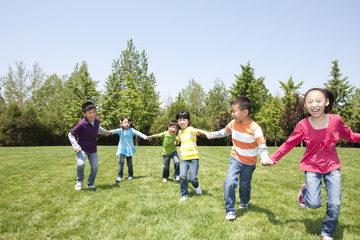 Young Children Playing in Field