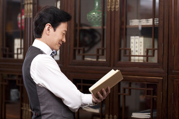 Fine gentleman reading a book