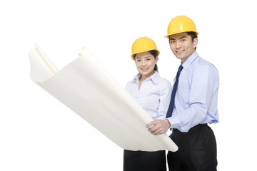 Construction management looking at blueprints