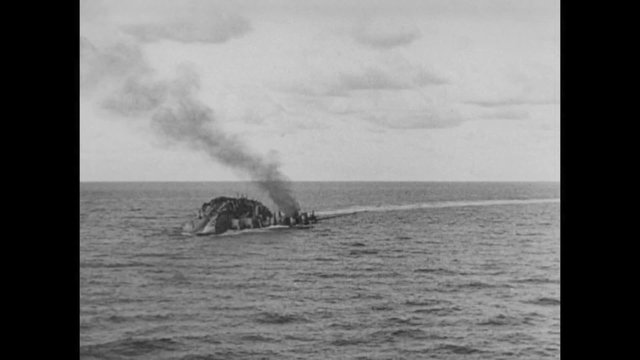 Warship sinking and exploding into the ocean, 1940s