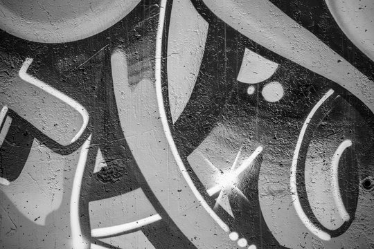 a city wall with graffiti in black and white, urban art