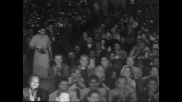 Montage of audience in theater clapping, 1950s