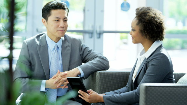 multi ethnic business male female manager advertising client tablet technology
