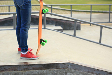 skateboarding legs at skatepark