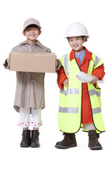 Boy and girl dressing up like delivery person and engineer