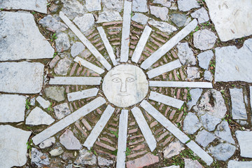mosaic, stylized sun in Athens, Greece.