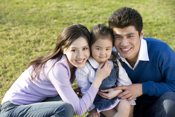 Portrait of young family at the park