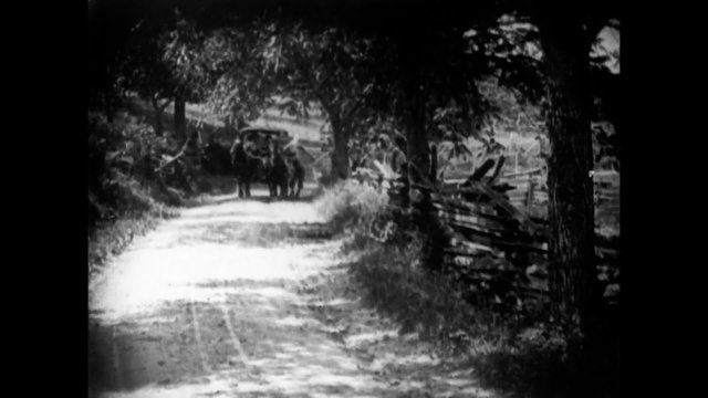 Man hitching a ride on  a horse cart, 1920s