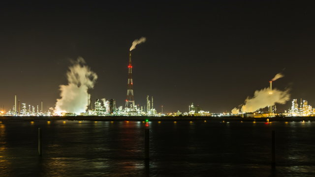 Timelapse sequence of a large oil refinery in the harbor of Antwerp, Belgium in the night in 4K.