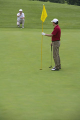 Fototapeta premium Two Golfers on the Green