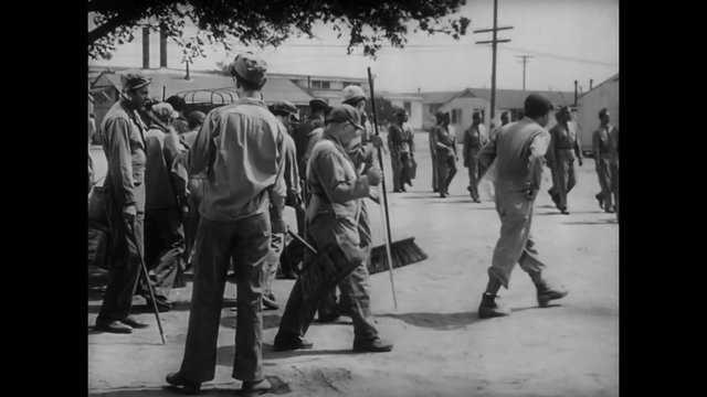 Soldiers receiving orders on work detail at training camp, 1940s