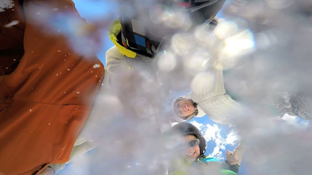 portrait young Caucasian family parents sons outdoor snow recreation teamwork 