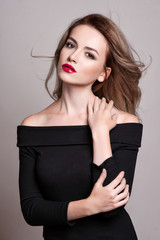 Fototapeta premium Portrait of beautiful blonde woman with curly hairstyle and bright makeup, perfect skin, skincare, spa, cosmetology. Sexy vogue woman face, sensual beauty girl model. Natural look. studio, isolated.