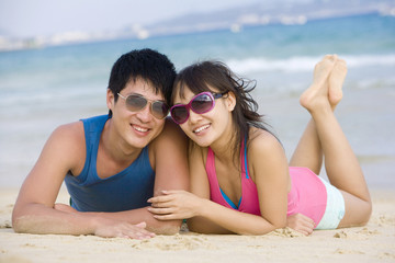 Fototapeta premium Portrait of a young couple at the beach