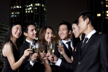 Friends Celebrating at an Outdoor Bar