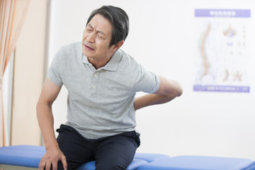 Senior patient suffering from backache