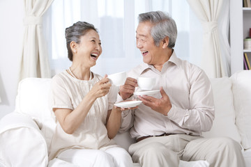 Happy couple enjoying tea
