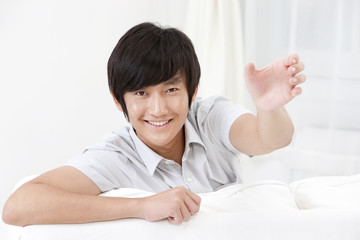 Young Man Holding Hand Up