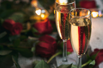 Valentine: Two Glasses Of Champagne With Roses Behind