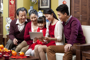 Family with digital tablet during Chinese New Year