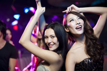 Stylish young people dancing in nightclub