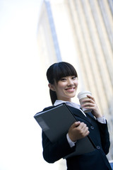 Woman with coffee and documents