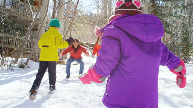 Caucasian family parents children healthy lifestyle snow mountains destination
