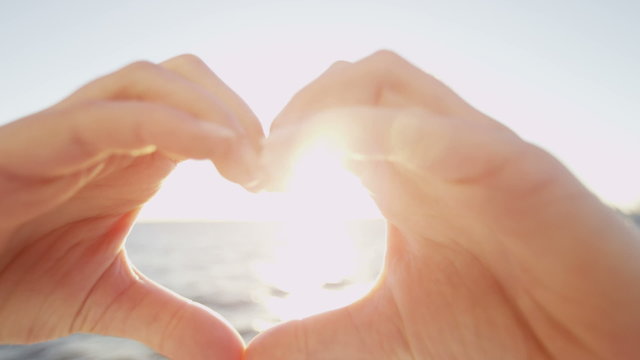 Female Caucasian Hands Heart Shape Photo Message Travel Tourism Ocean Sun Flare